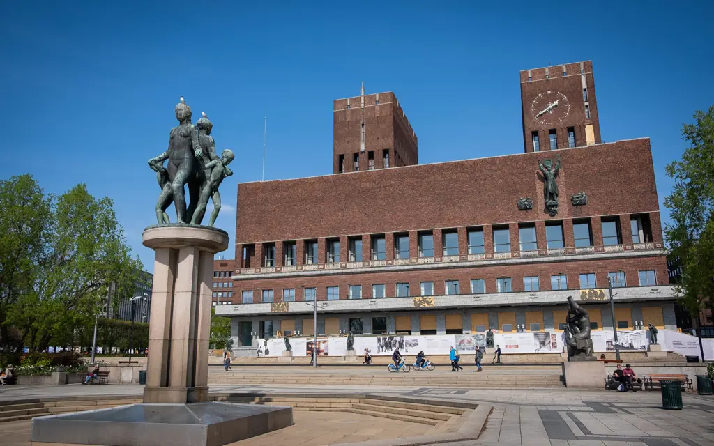 Oslo Rådhus, Oslo city hall, a brick building with a statue in front of