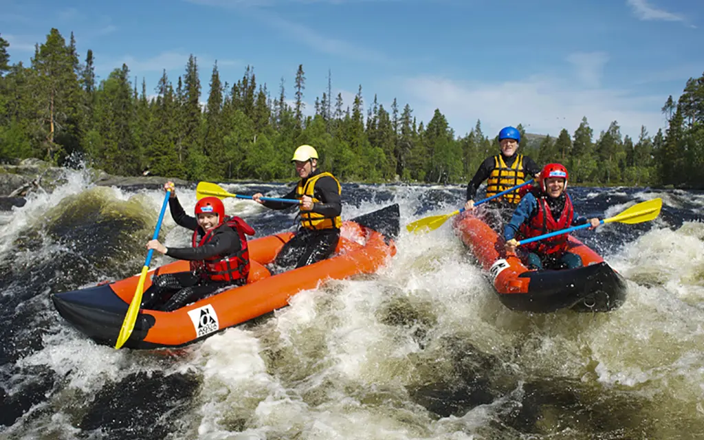 Two boats rafting down the river in Trysil